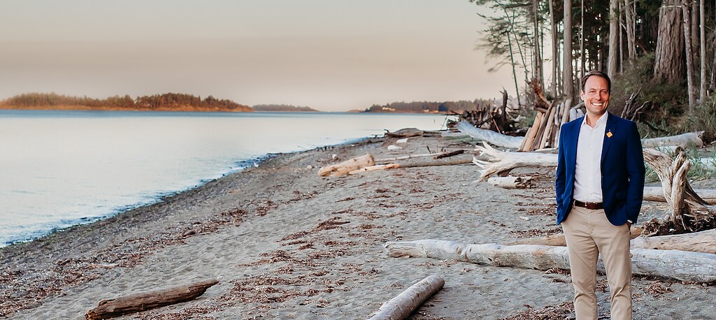 Adam Walker on the beach in Qualicum Beach at sunset